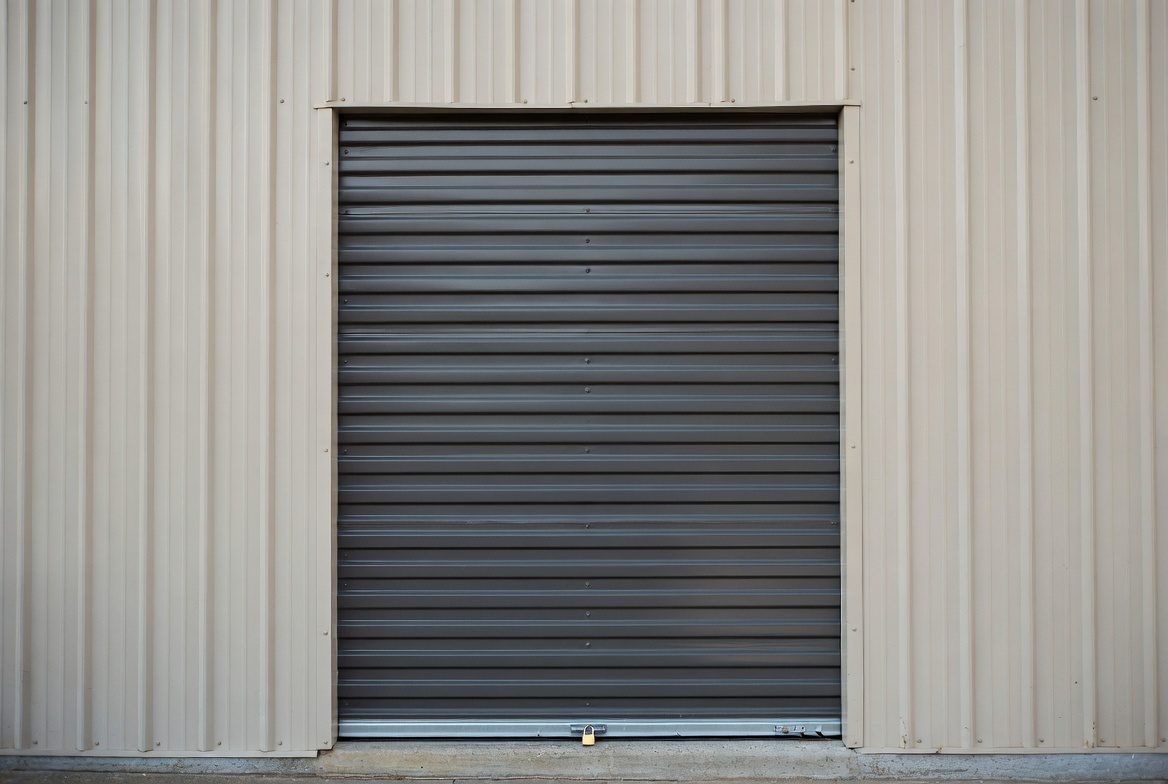 Close-up of steel roll-up sheet door on mini storage unit